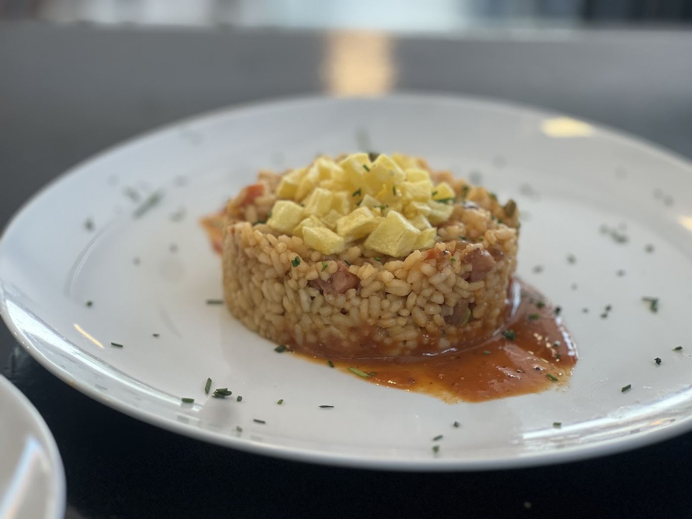 Arroz meloso con queso manchego y tomate natural